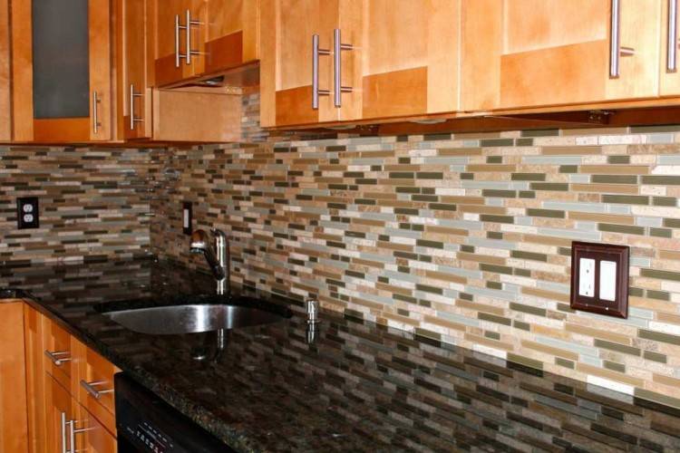 Kitchen backsplash featuring industrial tile laid horizontally