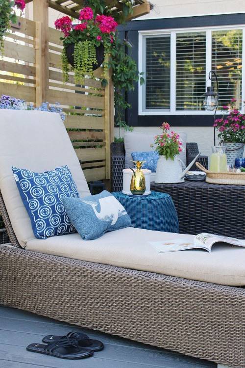 Beautiful summer patio decorated with pops  of blue