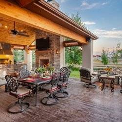 Complete outdoor living deck with finished roof and lighting