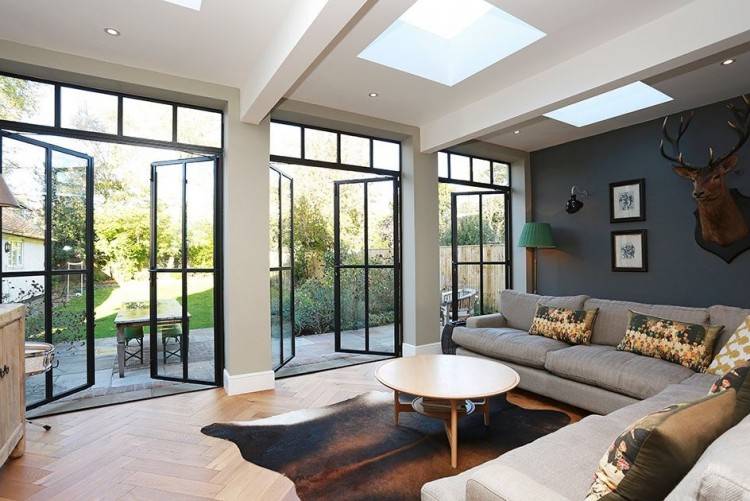 View in gallery Sectional glass garage door used in an eclectic living room