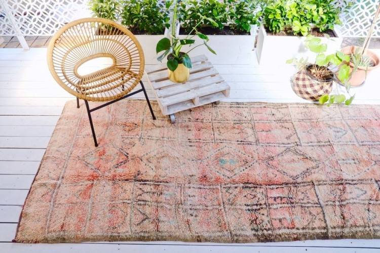 Two nearly monochrome Moroccan shag carpets in red swath the floor of this  Venice, California, beach House by Ashe + Leandro