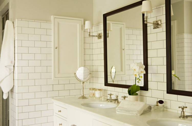 Kitchen image of white cabinets and white backsplash and stainless  appliances