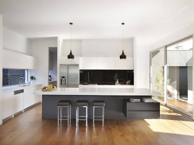 The Latest Trends in Kitchen Island Design Trade Lines for Curves and Mixed  Materials for Monolithic