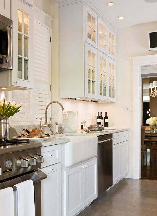 Gray tiles shape a lovely background in the small kitchen [Design:  CliqStudios Cabinets]