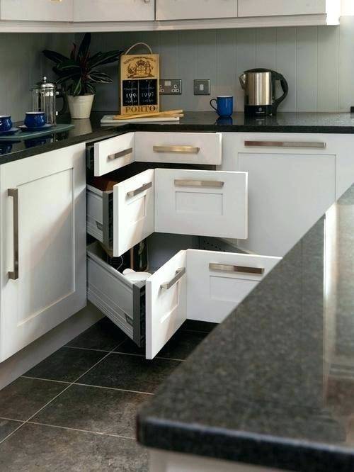 Curvy corner drawers steal the show in this kitchen [Design: Grace Blu  Designs]