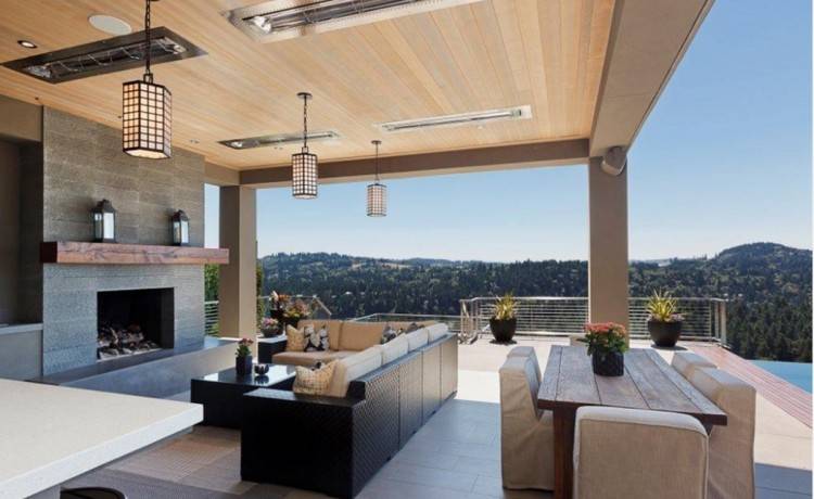 in a living room as outside under a barbecue area? The fireplace  flanked by open views on either side will provide warmth to guests  snuggling around it,