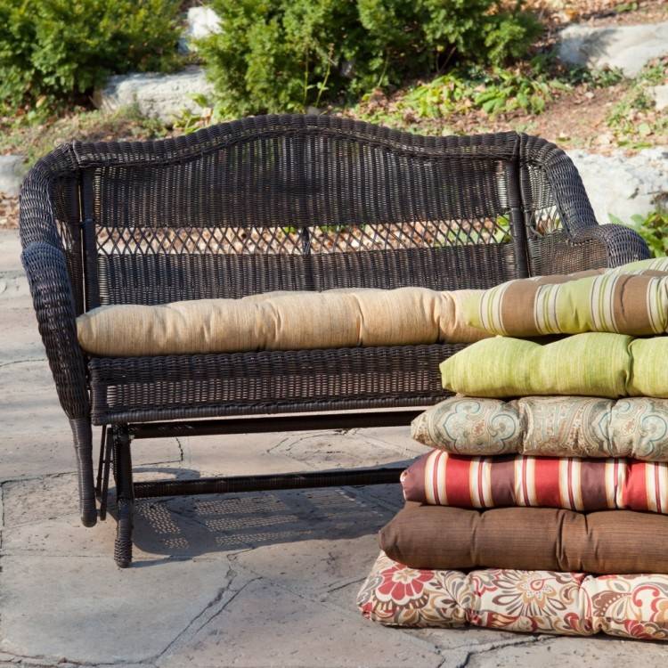 Grey outdoor cushions with yellow and grey decorative pillows and  yellow drapery