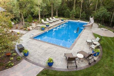 Clerestory windows and a skylight illuminate the curvy outline of the pool  from above