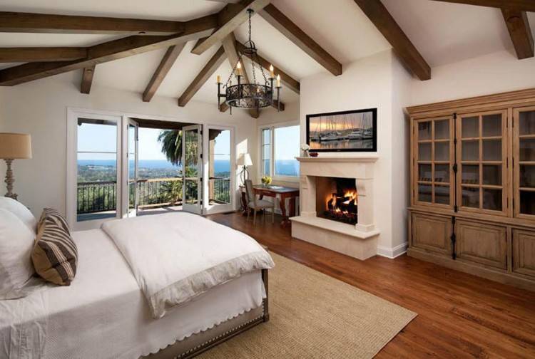 Reclaimed cedar fence turned into a fascinating feature wall in the  rustic bedroom [Design: