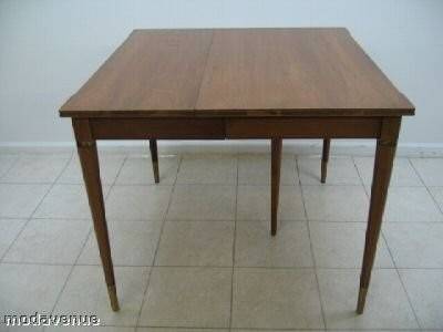 Tis is a fabulously simple and elegant Chestnut brown John Widdicomb dining  room table