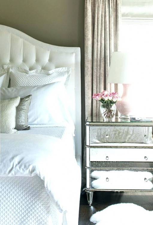 This silver nightstand was a DIY that works perfectly in this modern master  bedroom