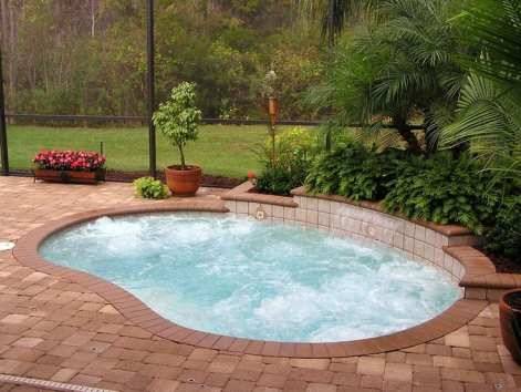 inground pool with raised hot tub tile ideas |