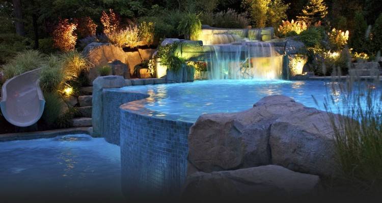 Natural swimming pool with stone pool decking