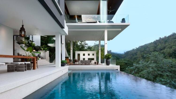 The simple clean lines of Asian architecture are used here to create a  beautiful, stately contemporary Asian house