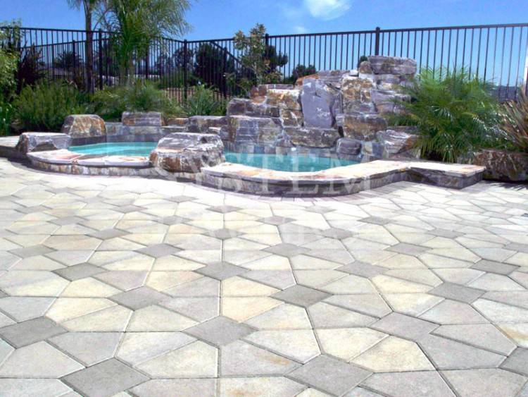 This Massapequa, NY pool patio, built with beautiful @unilock pavers, is  clean and modern yet wonderfully organic thanks to the curving lines (and  serene